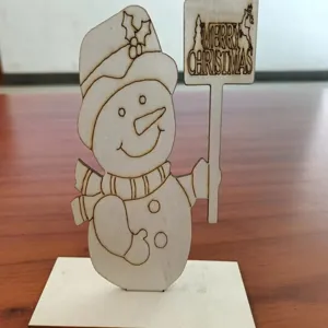 Wooden Christmas snowman tabletop decoration detail view, laser cut festive holiday decor ornament.