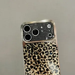 Luxury bling rhinestone leopard print protective phone case with gold metal frame design.