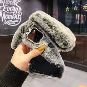 Custodia per cellulare in peluche con orecchie di coniglio e protezione fotocamera.