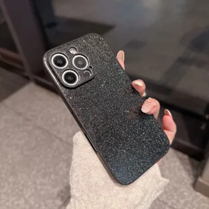 Close-up detail shot of the black glitter phone case, showing sparkling finish and camera cutouts.