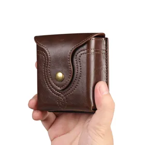 Detail view of a brown leather folding phone waist pouch with metal snap and neat stitching.