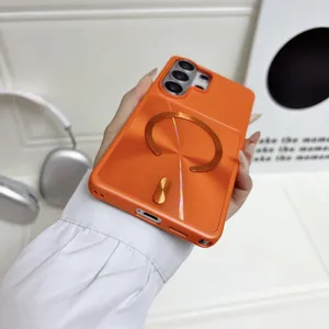 Orange magnetic shockproof phone case with metal ring stand, compatible for Samsung.