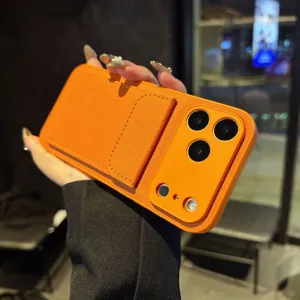 Orange leather phone case with card holder stand for iPhone, litchi pattern protective cover.