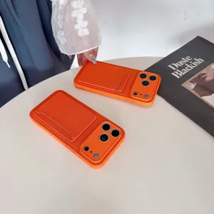 Detailed view of orange leather cardholder phone case with card slot and full camera protection.