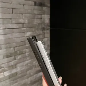 Detailed side view of protective phone case showing precise button cutouts and slim profile.