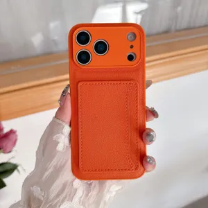 Orange leather phone case detail, back card holder slot, premium texture and precise cutouts.