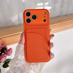 Close-up detail of orange leather phone case with back card slot holder for apple iPhone.