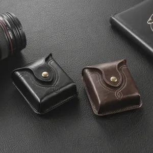 Detail shot of classic leather folding phone waist pouch with metal snap button and neat stitching.