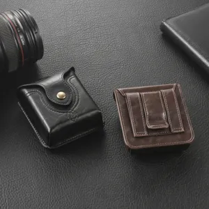 Detail shot of premium leather foldable phone waist pouch, belt loop design, black and brown.