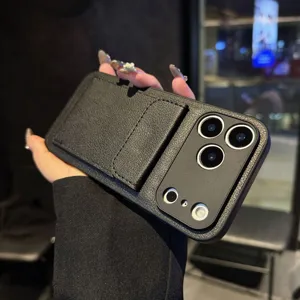 Black leather phone case detail showing built-in card holder wallet and kickstand slot design.