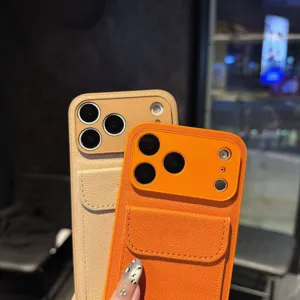 Close-up detail of litchi leather phone cases with card pocket stand in orange and beige.