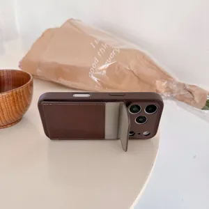 Brown leather phone case with cardholder stand detail view, durable protective cover.