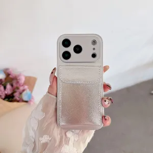 Silver leather card holder phone case detail, textured pebble finish with integrated stand feature.