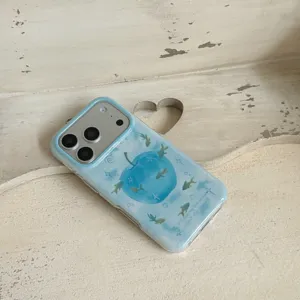 Gradient blue apple and fish iPhone case detail view, cute aesthetic protective mobile cover.