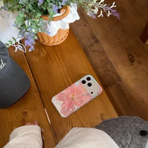 Pink lily and star pattern phone case detail shot, showing delicate floral design and finish.