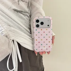 Detailed view of the pink polka dot phone case featuring double-layered rounded edges.