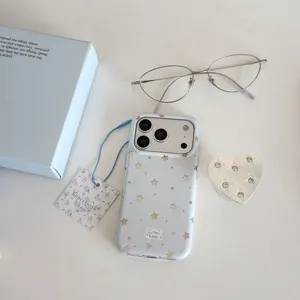 Cute Y2K clear star phone case with rhinestone heart grip and aesthetic accessories set.