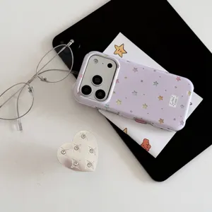 Aesthetic lilac star phone case and silver heart grip detail shot, perfect for iPhone.