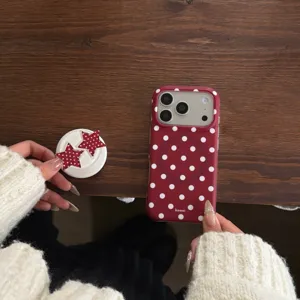 Red polka dot phone case and star stand detail shot showing premium matte finish.