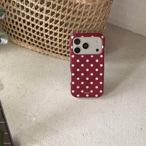 Red polka dot magnetic phone case detail view, stylish matte texture and cute design.