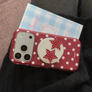 Detailed view of the red polka dot phone case with a cute star bracket design and matte finish.