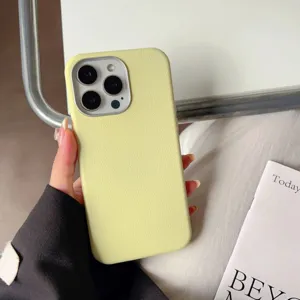 Detailed view of light yellow leather texture phone case showing fine camera cutout and grip.