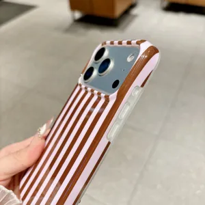 Detailed view of a brown and pink vertical striped phone case for iPhone, stylish look.