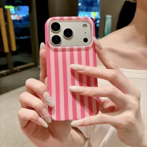 Pink vertical stripe phone case detail, stylish hand holding design view close up.