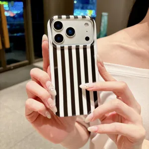 Close-up detail of the chic black and white vertical striped phone case, sleek IMD finish.