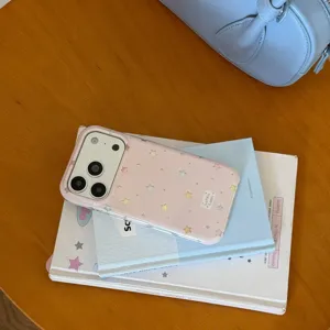 Detailed close-up shot of the pink transparent phone case featuring cute colorful stars.