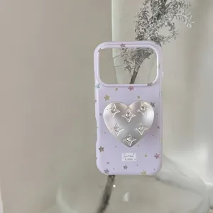 Lavender purple iPhone case detail showcasing colorful stars and a metallic heart socket grip.