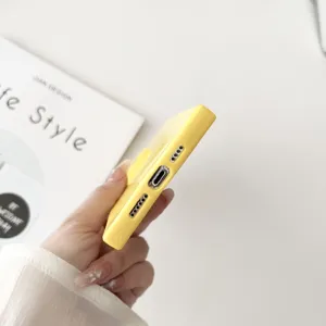 Detailed shot of yellow square TPU phone case showing precise bottom cutouts and ports.