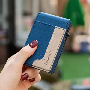 Detailed view of a vertical metal card holder with blue leather and magnetic flap design.