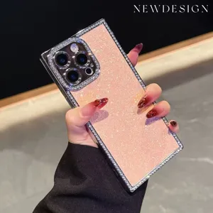 Detailed view of sparkly pink rhinestone phone case with electroplated square edges and camera.