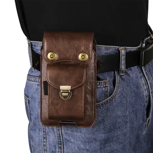 Detail view of the vertical brown PU leather double-pocket phone holster worn on belt.