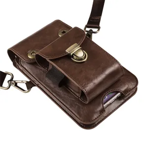 Detailed view of brown leather phone pouch with metal lock, dual compartments and shoulder strap.