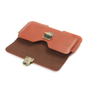 Detailed view of the brown leather phone holster showcasing the textured surface and clasp.