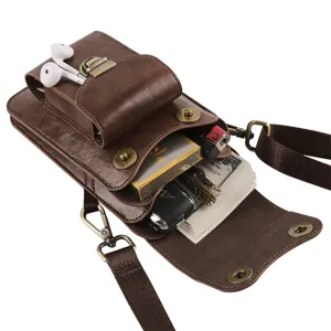 Detailed view of brown leather vertical multi-compartment waist bag showing high capacity.