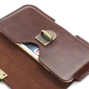 Detailed view of brown leather horizontal waist phone holster with vintage metal clasp and phone.