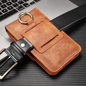 Funda de cuero marron para telefono con cinturon y anillo metalico, gran tamano util.