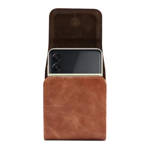 Detail view of brown leather texture vertical foldable phone holster with magnetic closure.