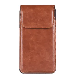 Close up detail of brown leather phone holster, vertical belt pouch with magnetic closure.