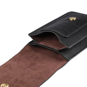 Close-up detail of black leather phone holster, double grid design with card slots and suede.