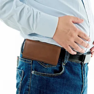 Brown PU leather belt phone holster worn on waist, showing double-layer utility and fit.