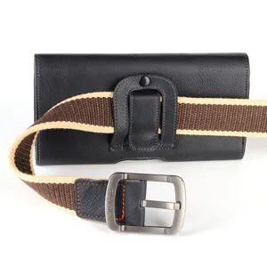 Close-up detail of black leather phone holster with canvas belt and metallic buckle design.