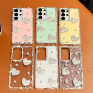 Showcase of luxury rhinestone heart and pearl phone cases in various vibrant colors and designs.