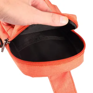 Orange nylon phone pouch interior detail view showing black lining and zipper compartment.