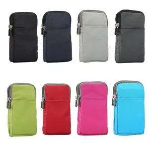 Detailed view of multi-color canvas phone waist bags, featuring double zipper compartments.