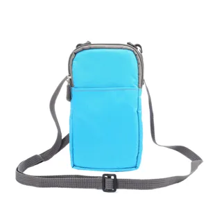 Blue canvas mini crossbody phone bag detail, adjustable grey strap, zipper closure, 6.9 inch.
