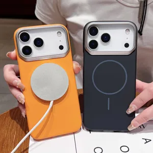 Close-up detail shot of magnetic silicone phone cases in orange and black with metal camera frame.